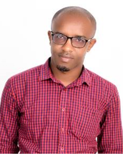 A man wears glasses and a red shirt.